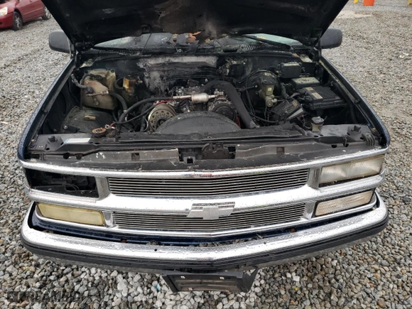 1999 Chevrolet Tahoe with VIN 1GNEC13R3XJ325377, listed as a Copart auction lot 83991974 with 257,816 mi miles and Salvage Title. Bid and sale history available at carsss.com. Image 12.