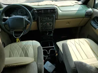 1998 Chevrolet Venture z VIN 1GNDX03E4WD312772, wystawiony jako Copart lot #70979804 z przebiegiem 94 037 mil mil oraz Tytuł czysty. Historia ofert i sprzedaży dostępna na DreamBid. Obrazek 8.