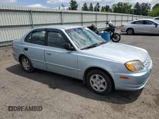 2004 Hyundai Accent GL z VIN KMHCG45C94U574027, wystawiony jako Copart lot #57463905 z przebiegiem 139 595 mil mil oraz Szkoda całkowita • Salvage title. Historia ofert i sprzedaży dostępna na DreamBid. Obrazek 4.