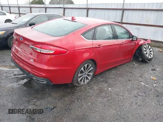 2020 Ford Fusion SE z VIN 3FA6P0T97LR234873, wystawiony jako IAAI lot #41510333 z przebiegiem 65 243 mil mil oraz . Historia ofert i sprzedaży dostępna na DreamBid. Obrazek 4.