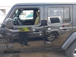 2023 Jeep Wrangler Sport S with VIN 1C4HJXDN6PW599895, listed as a IAAI auction lot 42242107 with 53,980 mi miles and . Bid and sale history available at DreamBid. Image 14.