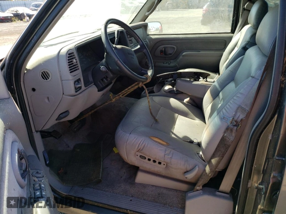 1999 GMC Yukon with VIN 1GKEC13R5XJ761595, listed as a Copart auction lot 69677904 with 174,735 mi miles and Clean Title. Bid and sale history available at carsss.com. Image 7.