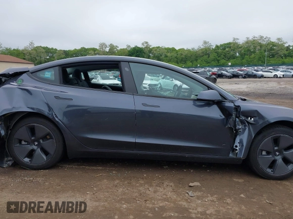 2023 Tesla Model 3 with VIN 5YJ3E1EA9PF673399, listed as a IAAI auction lot 42392643 with 7,571 mi miles and . Bid and sale history available at DreamBid. Image 14.