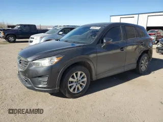 2016 Mazda CX-5 Sport z VIN JM3KE4BY3G0907976, wystawiony jako Copart lot #85238414 z przebiegiem 92 933 mil mil oraz Szkoda całkowita • Salvage title. Historia ofert i sprzedaży dostępna na DreamBid. Obrazek 1.
