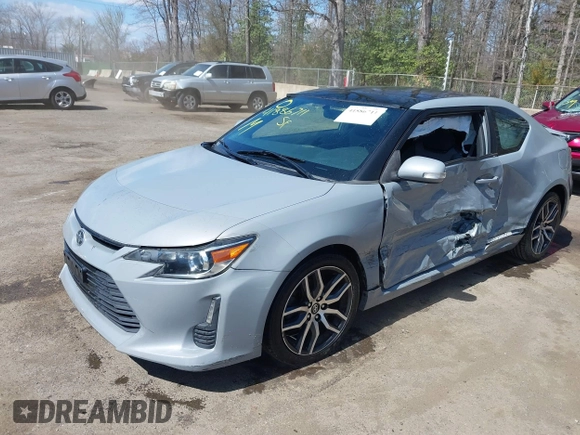 2014 Scion tC with VIN JTKJF5C70E3083839, listed as a IAAI auction lot 41886711 with 118,029 mi miles. Bid and sale history available at carsss.com. Image 2.