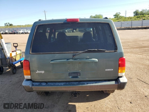 2000 Jeep Cherokee with VIN 1J4FF48S0YL198802, listed as a Copart auction lot 59996915 with 249,756 mi miles and Salvage title. Bid and sale history available at DreamBid. Image 6.