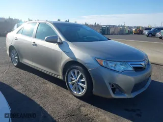 2014 Toyota Camry Hybrid LE with VIN 4T1BD1FK8EU097505, listed as a IAAI auction lot 38159878 with 379,573 mi miles. Bid and sale history available at carsss.com. Image 1.