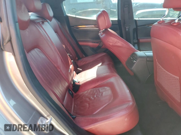 2014 Maserati Ghibli S Q4 z VIN ZAM57RTA6E1090293, wystawiony jako Copart lot #57298875 z przebiegiem 113 805 mil mil oraz Tytuł czysty. Historia ofert i sprzedaży dostępna na DreamBid. Obrazek 10.