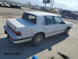 1993 Dodge Dynasty z VIN 1B3XC4632PD153627, wystawiony jako Copart lot #75645834 z przebiegiem 199 336 mil mil oraz Szkoda całkowita • Salvage title. Historia ofert i sprzedaży dostępna na DreamBid. Obrazek 3.