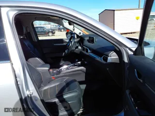 2020 Mazda CX-5 Grand Touring with VIN JM3KFADM7L0731479, listed as a IAAI auction lot 41697226 with 90,517 mi miles. Bid and sale history available at carsss.com. Image 5.