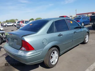 2003 Ford Focus SE with VIN 1FAFP34P53W162793, listed as a IAAI auction lot 42385636 with Not provided miles and . Bid and sale history available at DreamBid. Image 4.