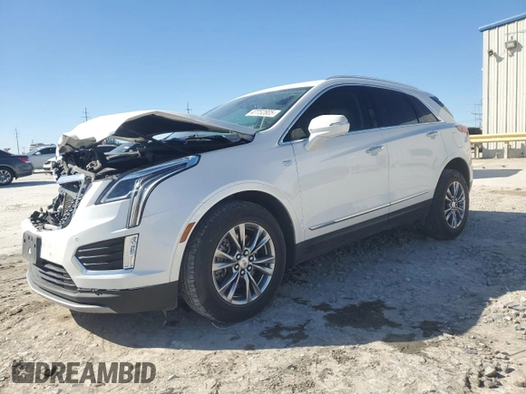 2021 Cadillac XT5 FWD Premium Luxury with VIN 1GYKNCRSXMZ135949, listed as a Copart auction lot 47752805 with 99,838 mi miles and Salvage Title. Bid and sale history available at carsss.com. Image 1.