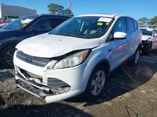 2016 Ford Escape SE with VIN 1FMCU0G97GUA80692, listed as a IAAI auction lot 41860124 with 122,251 mi miles. Bid and sale history available at carsss.com. Image 2.