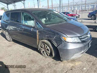 2014 Honda Odyssey EX-L with VIN 5FNRL5H61EB079742, listed as a IAAI auction lot 41992473 with 125,397 mi miles and . Bid and sale history available at carsss.com. Image 1.
