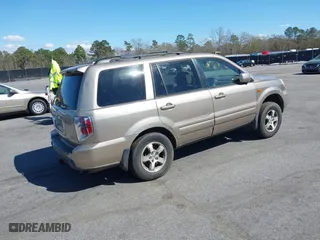 2006 Honda Pilot EX-L with VIN 5FNYF18516B020162, listed as a IAAI auction lot 41799229 with 304,627 mi miles. Bid and sale history available at carsss.com. Image 4.