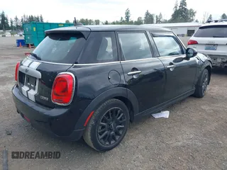 2015 MINI Hardtop 4 Door with VIN WMWXS5C58FT833420, listed as a IAAI auction lot 42560244 with 115,446 mi miles and . Bid and sale history available at DreamBid. Image 4.