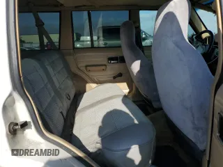1996 Jeep Cherokee SE z VIN 1J4FJ28S7TL270218, wystawiony jako Copart lot #55302885 z przebiegiem 239 209 mil mil oraz Szkoda całkowita • Salvage title. Historia ofert i sprzedaży dostępna na DreamBid. Obrazek 10.