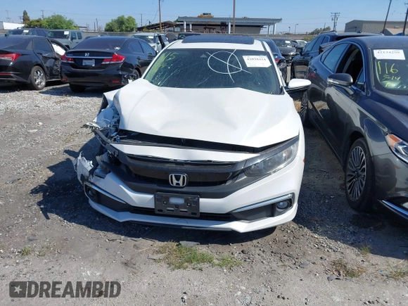 2020 Honda Civic EX-L with VIN 19XFC1F70LE203137, listed as a IAAI auction lot 42028424 with 87,011 mi miles and . Bid and sale history available at DreamBid. Image 13.