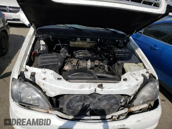 2000 Mercedes-Benz M-Class with VIN 4JGAB54E5YA165660, listed as a Copart auction lot 65872364 with 115,668 mi miles and Salvage Title. Bid and sale history available at carsss.com. Image 12.