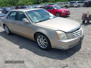 2006 Cadillac DTS 1SE z VIN 1G6KD57936U245734, wystawiony jako IAAI lot #42238256 z przebiegiem 209 188 mil mil oraz . Historia ofert i sprzedaży dostępna na DreamBid. Obrazek 1.