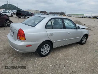 2004 Hyundai Accent GL with VIN KMHCG45C94U564176, listed as a Copart auction lot 82963944 with 454,400 mi miles and Salvage Title. Bid and sale history available at carsss.com. Image 3.