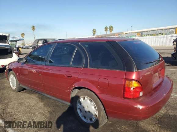 1997 Saturn SW z VIN 1G8ZK8272VZ371975, wystawiony jako Copart lot #75880424 z przebiegiem 121 194 mil mil oraz Szkody całkowita. Historia ofert i sprzedaży dostępna na DreamBid. Obrazek 2.