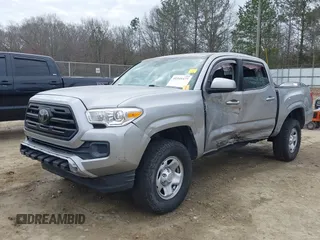 2018 Toyota Tacoma SR with VIN 3TMCZ5AN4JM130307, listed as a IAAI auction lot 41541477 with 74,369 mi miles and . Bid and sale history available at DreamBid. Image 6.