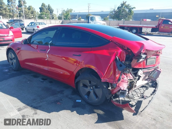 2023 Tesla Model 3 with VIN 5YJ3E1EA1PF385490, listed as a IAAI auction lot 42315884 with 17,590 mi miles and . Bid and sale history available at DreamBid. Image 3.