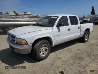 2002 Dodge Dakota SLT z VIN 1B7HL48N22S611236, wystawiony jako Copart lot #53005055 z przebiegiem Nie podano mil oraz Czysty tytuł • Clean title. Historia ofert i sprzedaży dostępna na DreamBid. Obrazek 1.