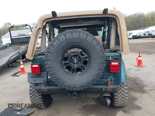 1999 Jeep Wrangler Sahara with VIN 1J4FY49S7XP440582, listed as a IAAI auction lot 41967151 with 163,710 mi miles and . Bid and sale history available at carsss.com. Image 16.