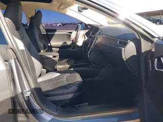 2014 Tesla Model S 60 with VIN 5YJSA1S10EFP32851, listed as a IAAI auction lot 41730746 with 91,657 mi miles and . Bid and sale history available at DreamBid. Image 5.