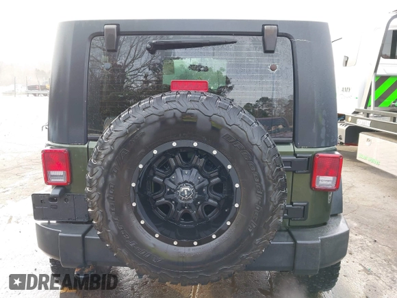 2009 Jeep Wrangler Rubicon z VIN 1J8GA64169L743008, wystawiony jako IAAI lot #41792451 z przebiegiem 142 414 mil mil oraz . Historia ofert i sprzedaży dostępna na DreamBid. Obrazek 16.