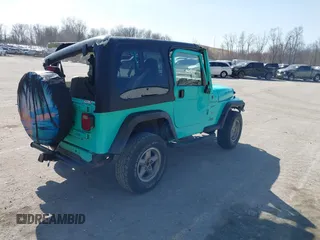 1997 Jeep Wrangler Sport with VIN 1J4FY19S2VP423426, listed as a IAAI auction lot 41734992 with 164,706 mi miles. Bid and sale history available at carsss.com. Image 4.