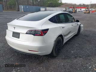 2021 Tesla Model 3 Long Range with VIN 5YJ3E1EB8MF974007, listed as a IAAI auction lot 41915513 with 107,354 mi miles and . Bid and sale history available at carsss.com. Image 4.