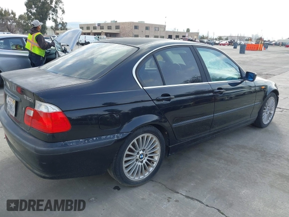 2003 BMW 3 Series 330i with VIN WBAEV534X3KM29039, listed as a IAAI auction lot 41850238 with 127,791 mi miles. Bid and sale history available at carsss.com. Image 4.