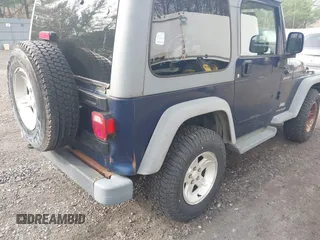 2005 Jeep Wrangler Sport with VIN 1J4FA49S25P302627, listed as a IAAI auction lot 42100601 with 169,650 mi miles. Bid and sale history available at carsss.com. Image 6.