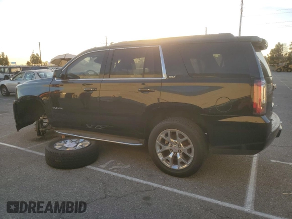 2015 GMC Yukon SLT with VIN 1GKS1BKC9FR144289, listed as a Copart auction lot 42179675 with 122,807 mi miles and Salvage Title. Bid and sale history available at carsss.com. Image 2.