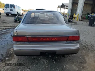 1990 Nissan Maxima z VIN JN1HJ01P3LT393901, wystawiony jako Copart lot #79912694 z przebiegiem 127 678 mil mil oraz Szkody całkowita. Historia ofert i sprzedaży dostępna na DreamBid. Obrazek 6.