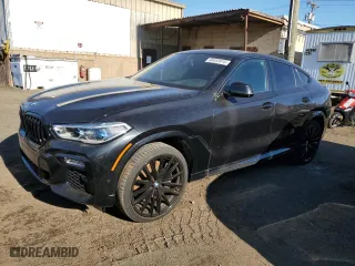 2020 BMW X6 M50i with VIN 5UXCY8C06L9C64986, listed as a Copart auction lot 88403915 with 17,300 mi miles and Salvage Title. Bid and sale history available at carsss.com. Image 1.