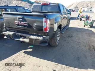 2021 GMC Canyon 4WD Denali z VIN 1GTG6EEN9M1240596, wystawiony jako IAAI lot #40760124 z przebiegiem 52 985 mil mil oraz . Historia ofert i sprzedaży dostępna na DreamBid. Obrazek 4.