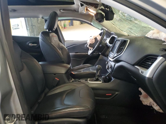 2014 Jeep Cherokee Trailhawk with VIN 1C4PJMBSXEW213981, listed as a Copart auction lot 60440495 with 136,612 mi miles and Salvage title. Bid and sale history available at DreamBid. Image 7.