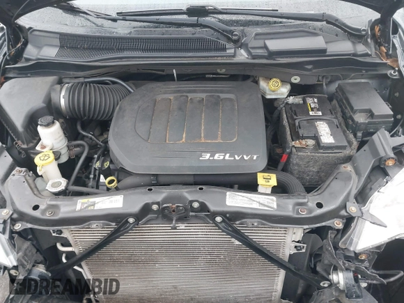 2014 Dodge Grand Caravan SXT with VIN 2C4RDGCG2ER463395, listed as a IAAI auction lot 41709948 with 137,783 mi miles and . Bid and sale history available at DreamBid. Image 10.