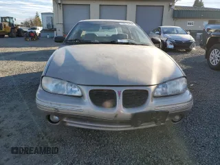 1996 Pontiac Grand Am SE2 with VIN 1G2NE52T3TC834038, listed as a Copart auction lot 76610794 with 140,379 mi miles and Salvage Title. Bid and sale history available at carsss.com. Image 5.