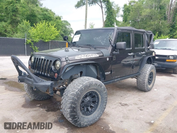 2013 Jeep Wrangler Unlimited Rubicon with VIN 1C4BJWFG5DL652050, listed as a IAAI auction lot 42451954 with 107,110 mi miles and . Bid and sale history available at DreamBid. Image 2.