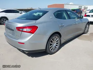 2014 Maserati Ghibli S Q4 with VIN ZAM57RTA8E1085631, listed as a IAAI auction lot 41829745 with 80,418 mi miles. Bid and sale history available at carsss.com. Image 4.