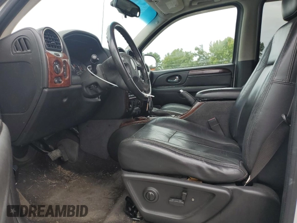 2005 GMC Envoy SLT with VIN 1GKDS13S652330496, listed as a Copart auction lot 73317234 with 191,138 mi miles and Salvage Title. Bid and sale history available at DreamBid. Image 7.