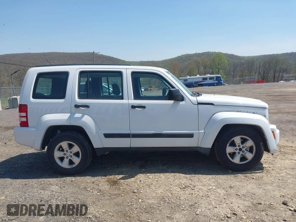 2012 Jeep Liberty Sport z VIN 1C4PJMAK7CW209305, wystawiony jako IAAI lot #42105378 z przebiegiem 136 617 mil mil oraz . Historia ofert i sprzedaży dostępna na DreamBid. Obrazek 13.