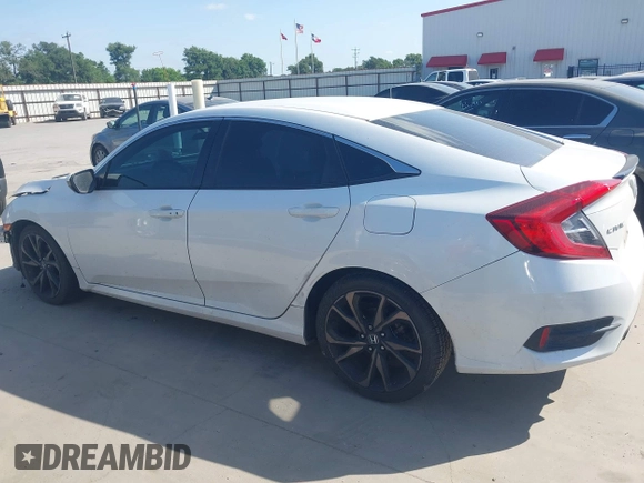 2019 Honda Civic Sport with VIN 19XFC2F81KE024702, listed as a IAAI auction lot 42018077 with 98,613 mi miles and . Bid and sale history available at DreamBid. Image 14.