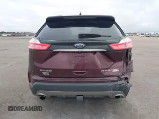 2020 Ford Edge Titanium z VIN 2FMPK4K91LBB56297, wystawiony jako IAAI lot #41938896 z przebiegiem 79 875 mil mil oraz . Historia ofert i sprzedaży dostępna na DreamBid. Obrazek 16.