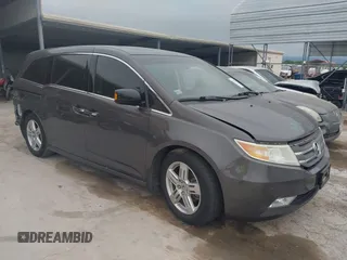 2012 Honda Odyssey Touring with VIN 5FNRL5H90CB045007, listed as a IAAI auction lot 42169324 with 186,756 mi miles and . Bid and sale history available at DreamBid. Image 1.